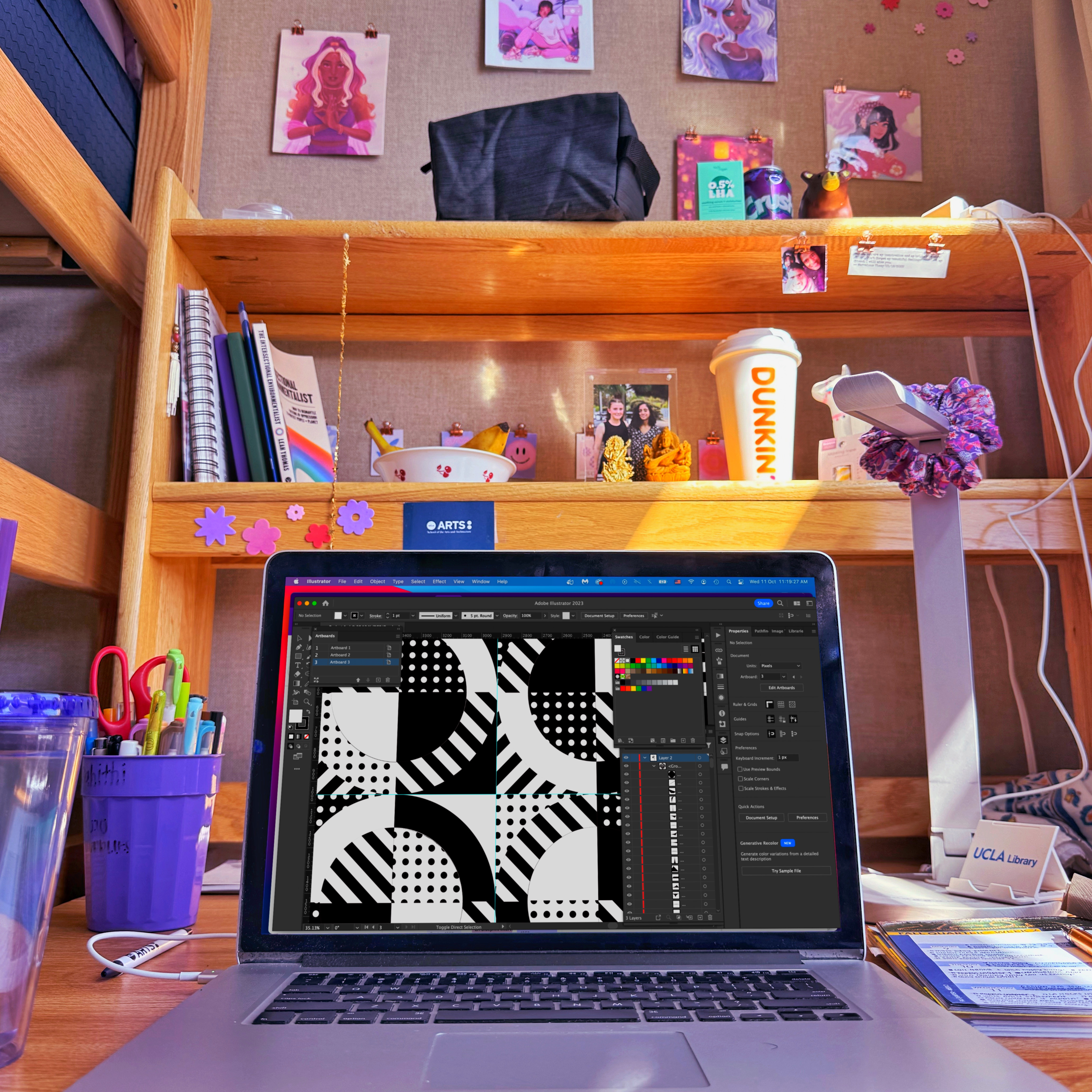 My UCLA dorm desk with my computer in the foreground with a black and white graphic I designed.